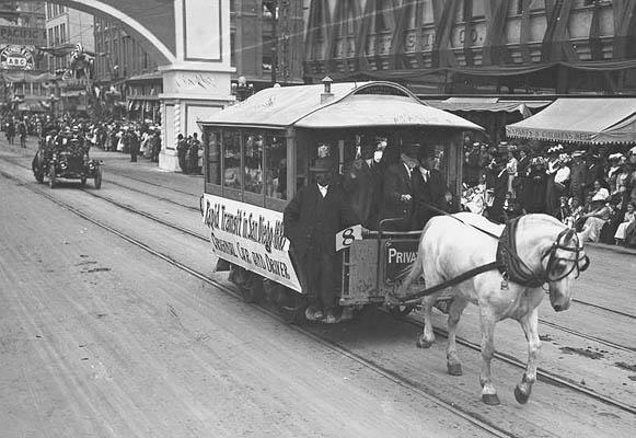 Image of a horsecar and an early automobile